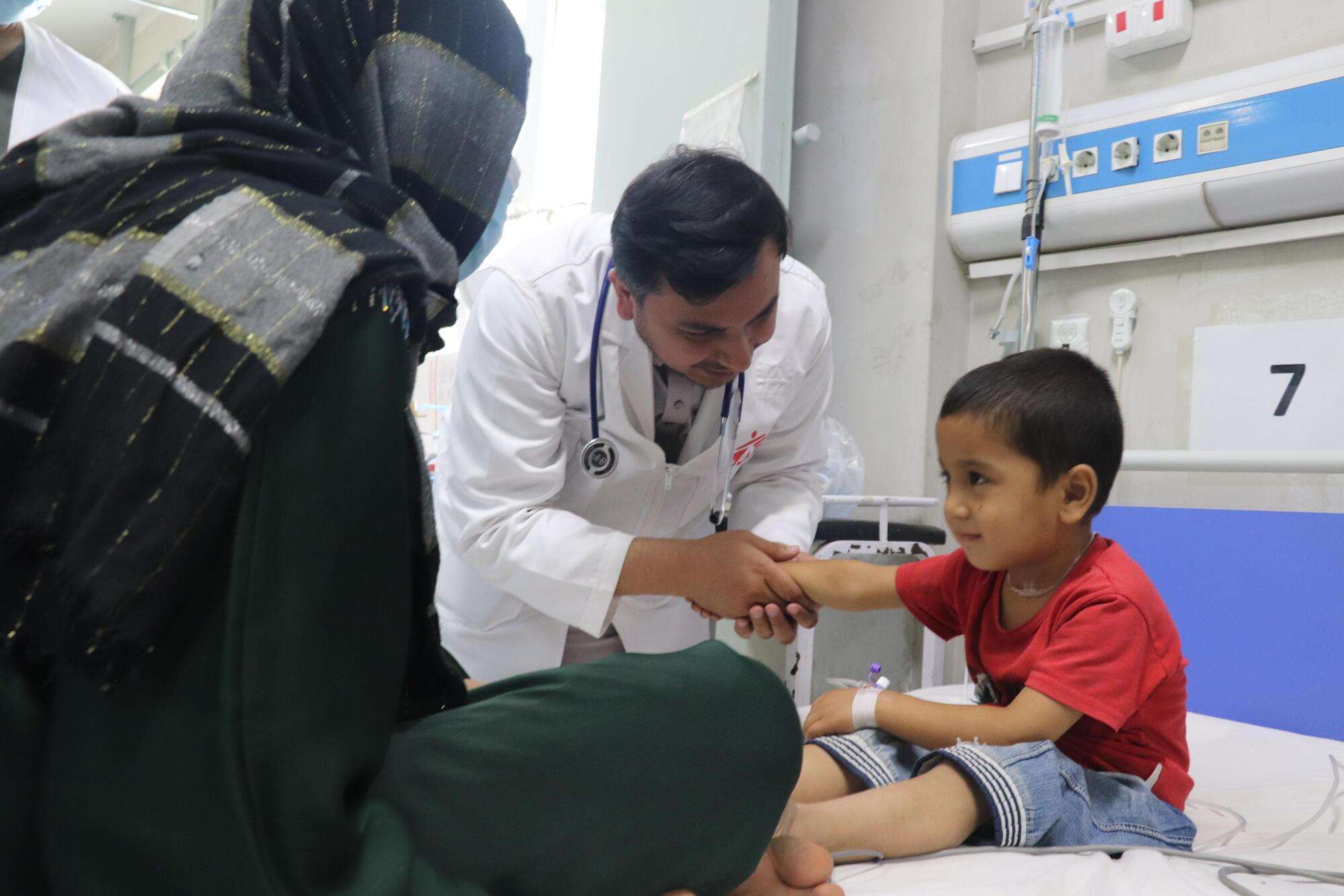 A doctor examines a boy in Afghanistan. 