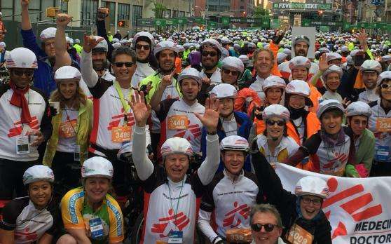 A cycling team celebrates after racing and raising funds for MSF